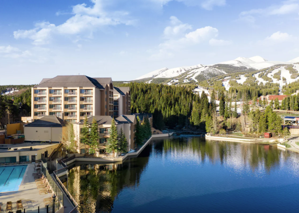 exterior of Marriott Mountain Valley Lodge at Breckenridge, with lake and mountain in surroundings