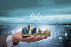 rendition of a digital city with wireless symbol in the palm of a person's hand