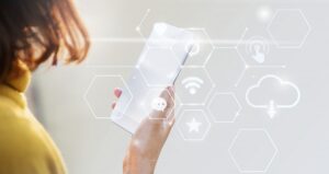 woman looking at phone, overlaid with icons for wireless and other services
