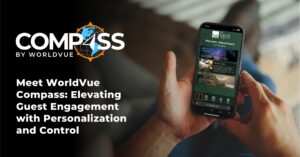 Compass by WorldVue logo with image of a person holding a phone with the Compass app on the screen, along with words saying "Meet WorldVue Compass: Elevating Guest Engagement with Personalization and Control"
