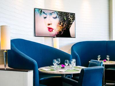 photo of seating in dining area with artwork