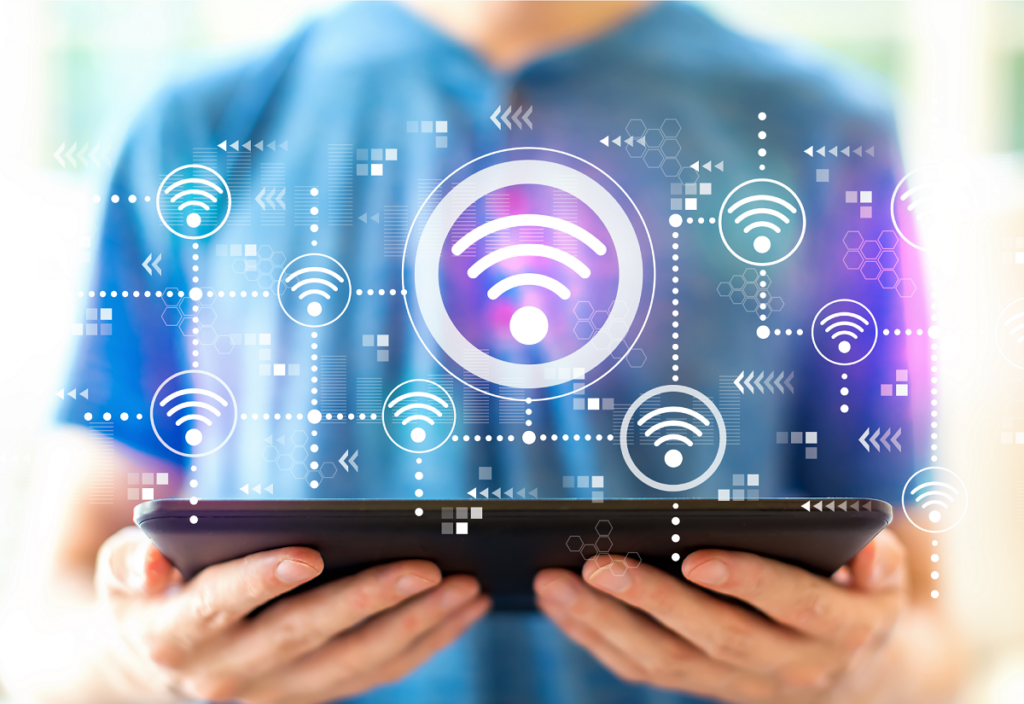person using wifi on tablet with wifi symbols overlaid