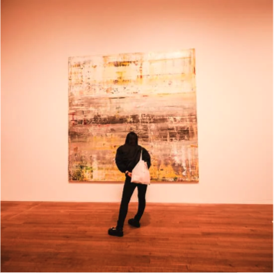 example of creative solutions- person viewing digital art on wall