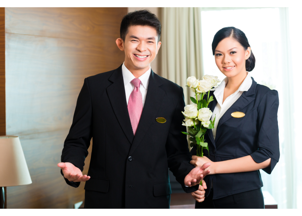 staff offering a personal touch with a greeting and flowers