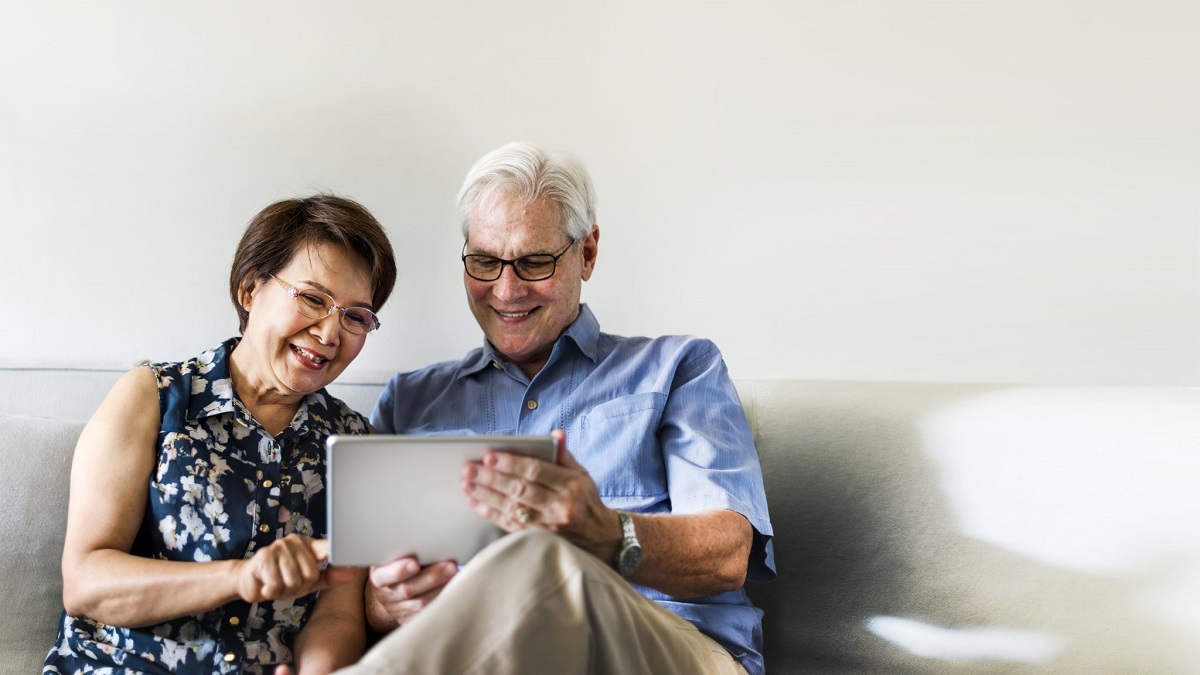 seniors viewing a tablet