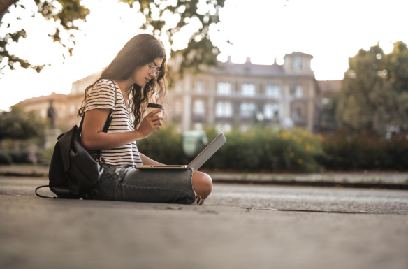 student housing connectivity being used by student on laptop outdoors
