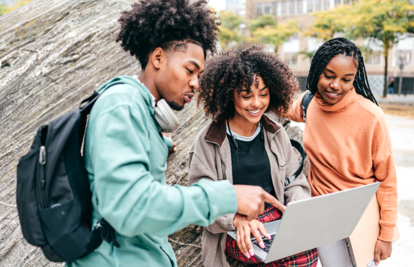 student housing connectivity being used by a group of students discussing content on a laptop
