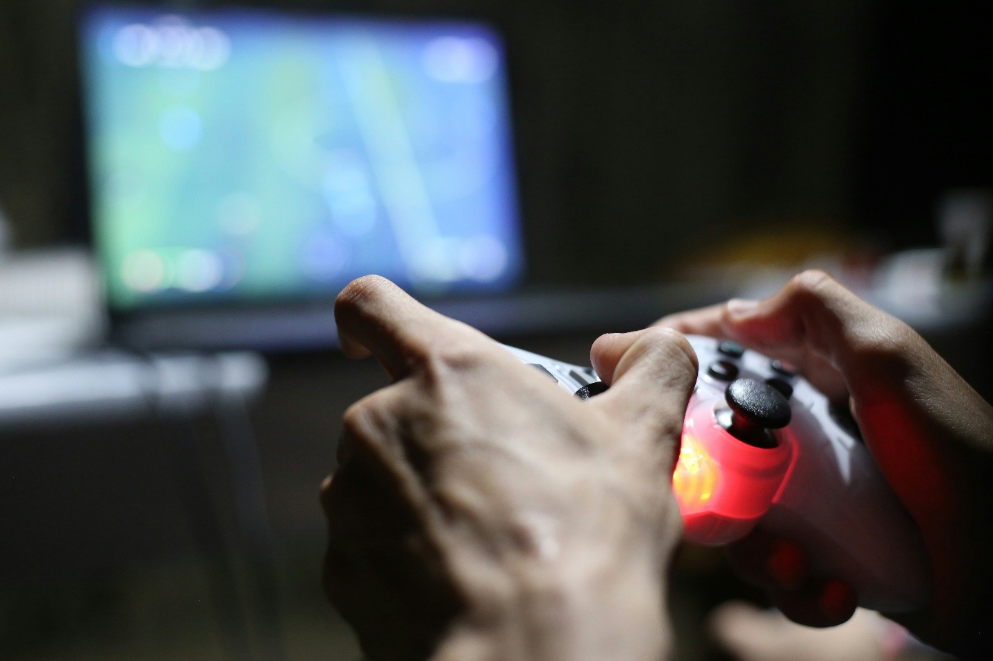 a guest using a gaming console with the in-room TV