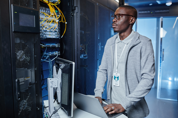 an engineer performing tasks in a server room as part of Network as a Service (NaaS)